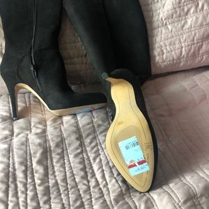 Black soft material long heeled boots